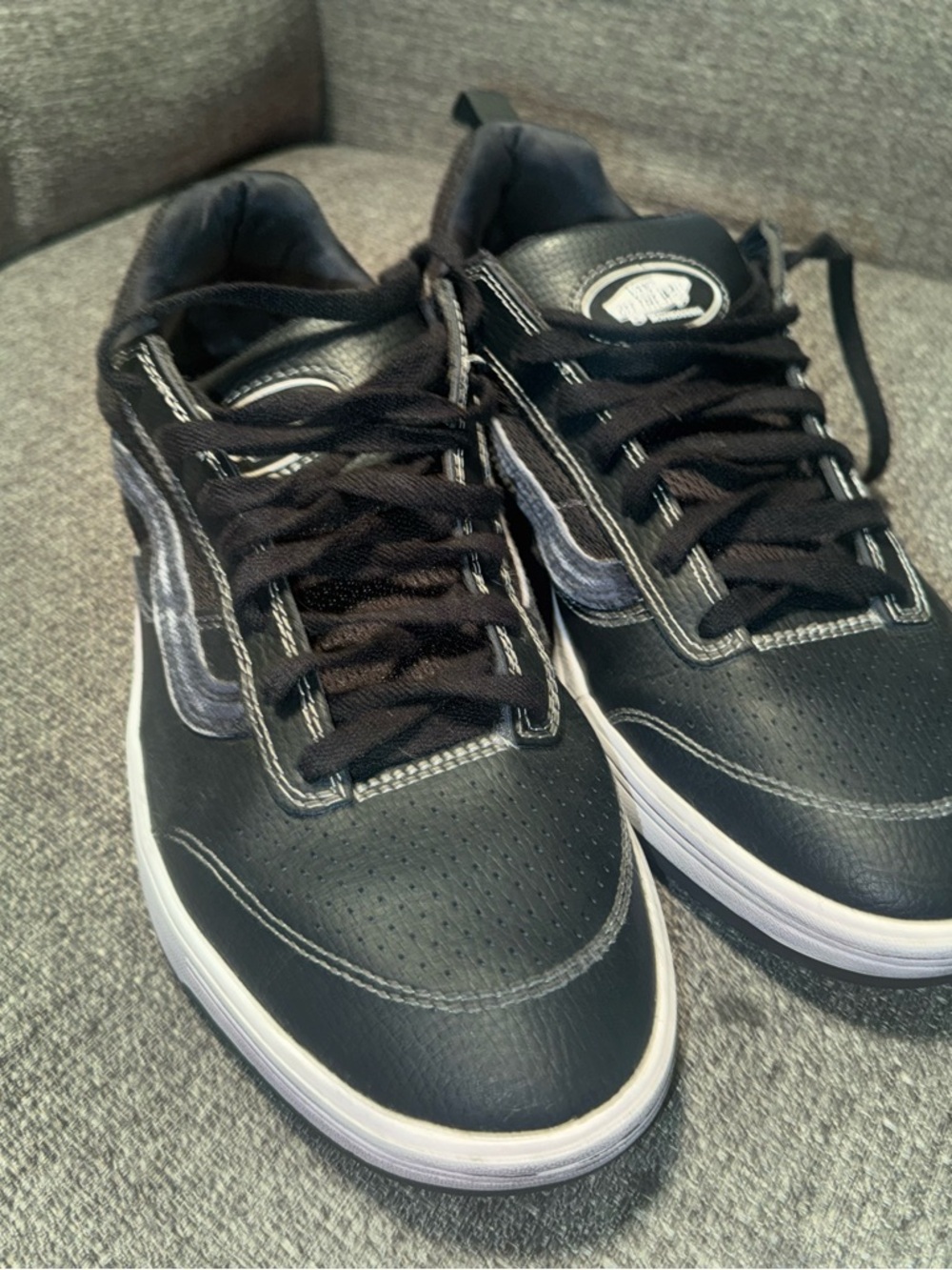 Vans Black Low-Top Sneakers with white stitching accents